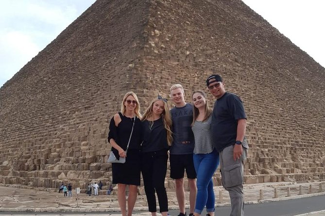 Best top rated Giza Pyramids and Sphinx Half Day Tour From Cairo - Standing before Khufu, the Great Pyramid