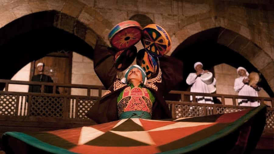 Cairo: Egyptian Heritage Tanoura Dancing Troupe Show - Outdoor seating, indoor winter performances, and comfort