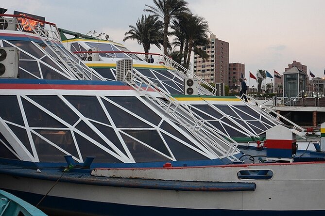 Cairo/Giza: Sunset Dinner Cruise on the Nile River Tour with Show - Cairo after dark from the river