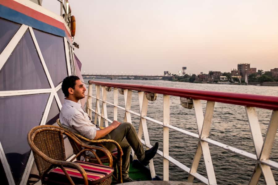 Cairo: Nile Sunset Dinner Cruise, Show & Optional Transfer - Boarding the boat and choosing your view
