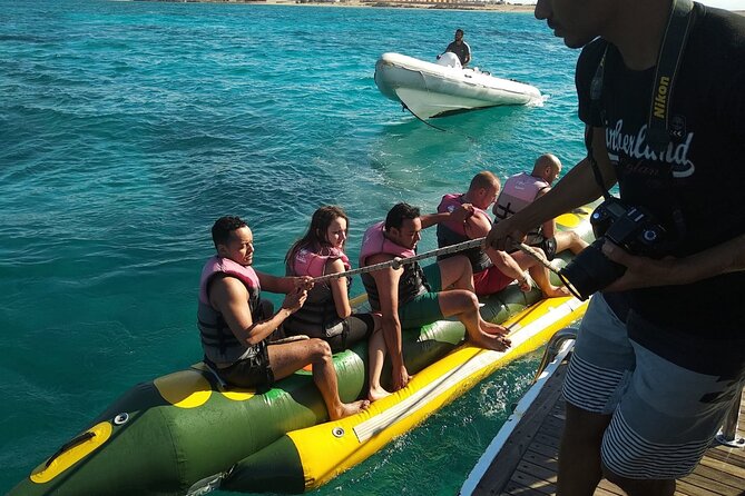 Dolphin tour & banana boat fun with snorkeling from Hurghada - Lunch, drinks, and life on the boat