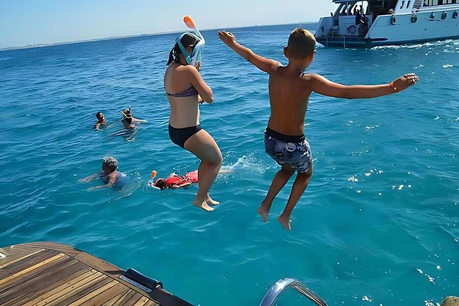 Hurghada: Dolphin Watching Boat Tour with Snorkeling & Lunch - Two reef stops with fish and coral
