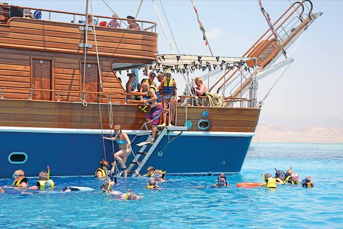 Hurghada Pirates sailing boat to Orange bay & Buffet Lunch - Boarding a twin-masted wooden ship