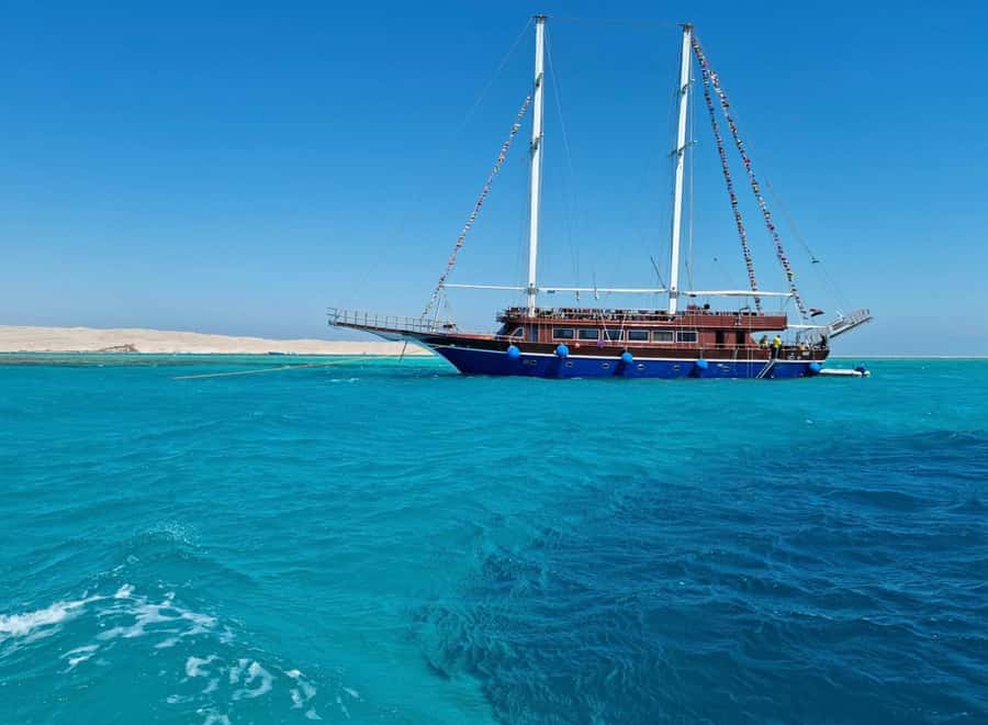 Hurghada: Pirates Sailing Boat to Orange Bay with Transfers - Languages, access, and what to pack