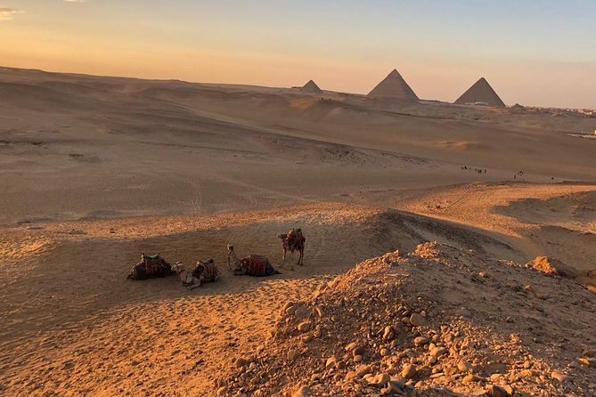 sunset at Giza pyramids by camels - The ride begins outside the archaeological site