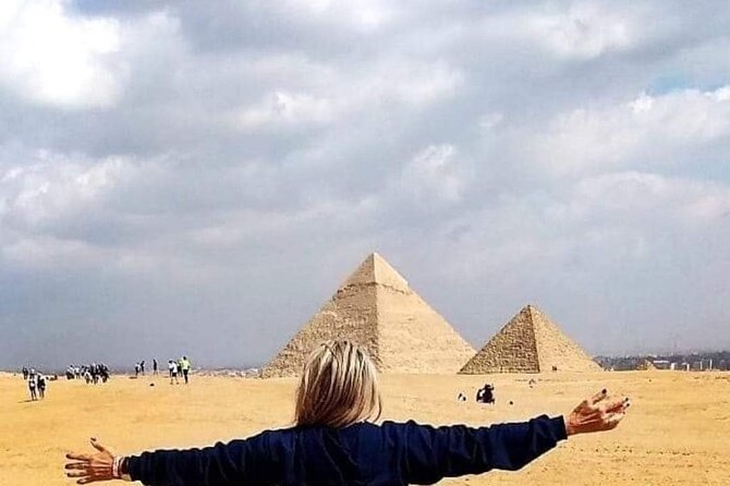 The best private inclusive half day tour at Giza pyramids . - Seeing the Great Pyramid from the Giza Plateau